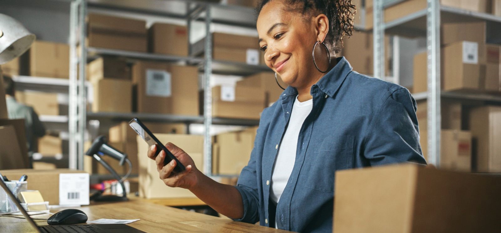 Woman on phone in warehouse