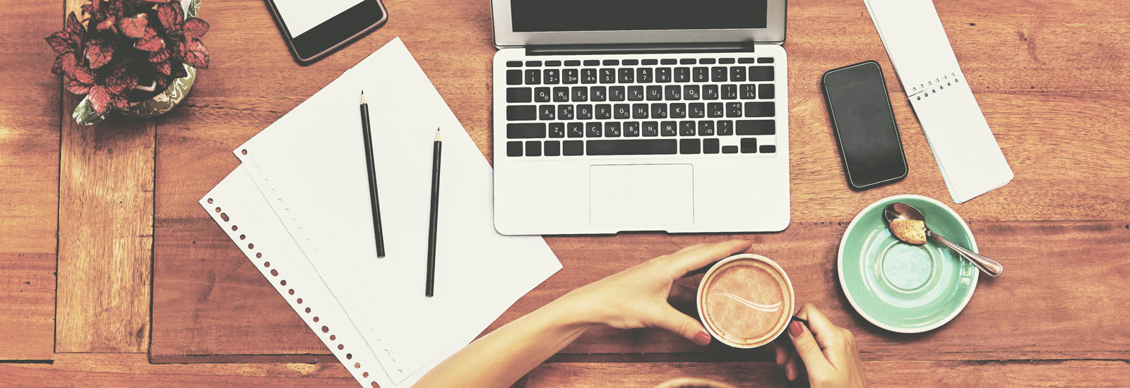 Person at laptop with coffee